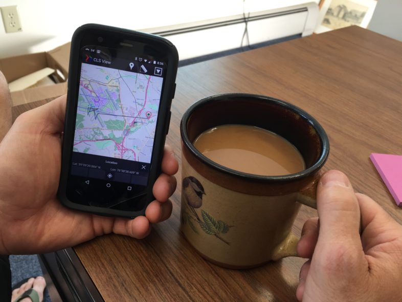 VCE biologist Jason Hill checks in on a satellite-tagged Upland Sandpiper that has spent the last week in between the runways at Baltimore Washington International Airport.